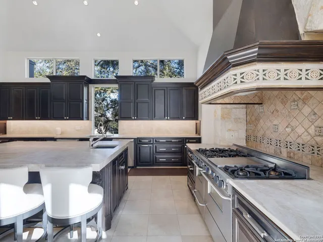 an empty room with windows and outdoor view