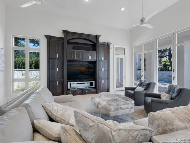 a view of an empty room with a fireplace