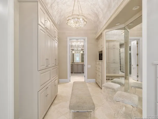 a bathroom with a shower and a glass door