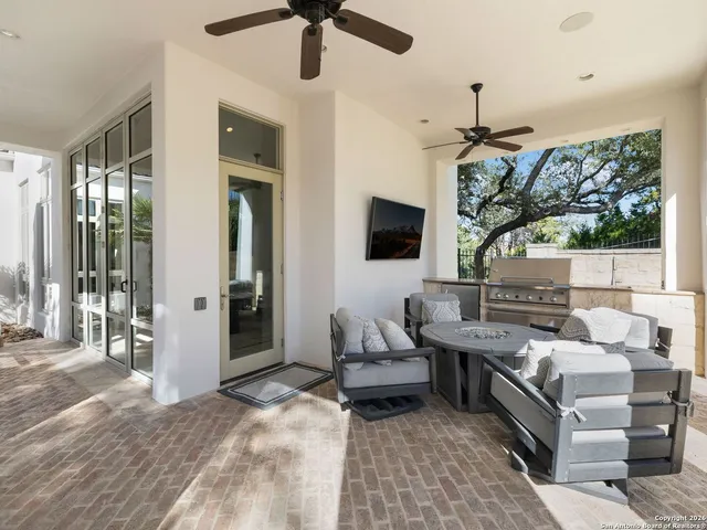 an aerial view of multiple houses with yard