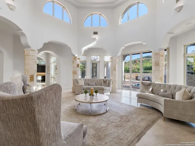 a view of a dining room with furniture and window