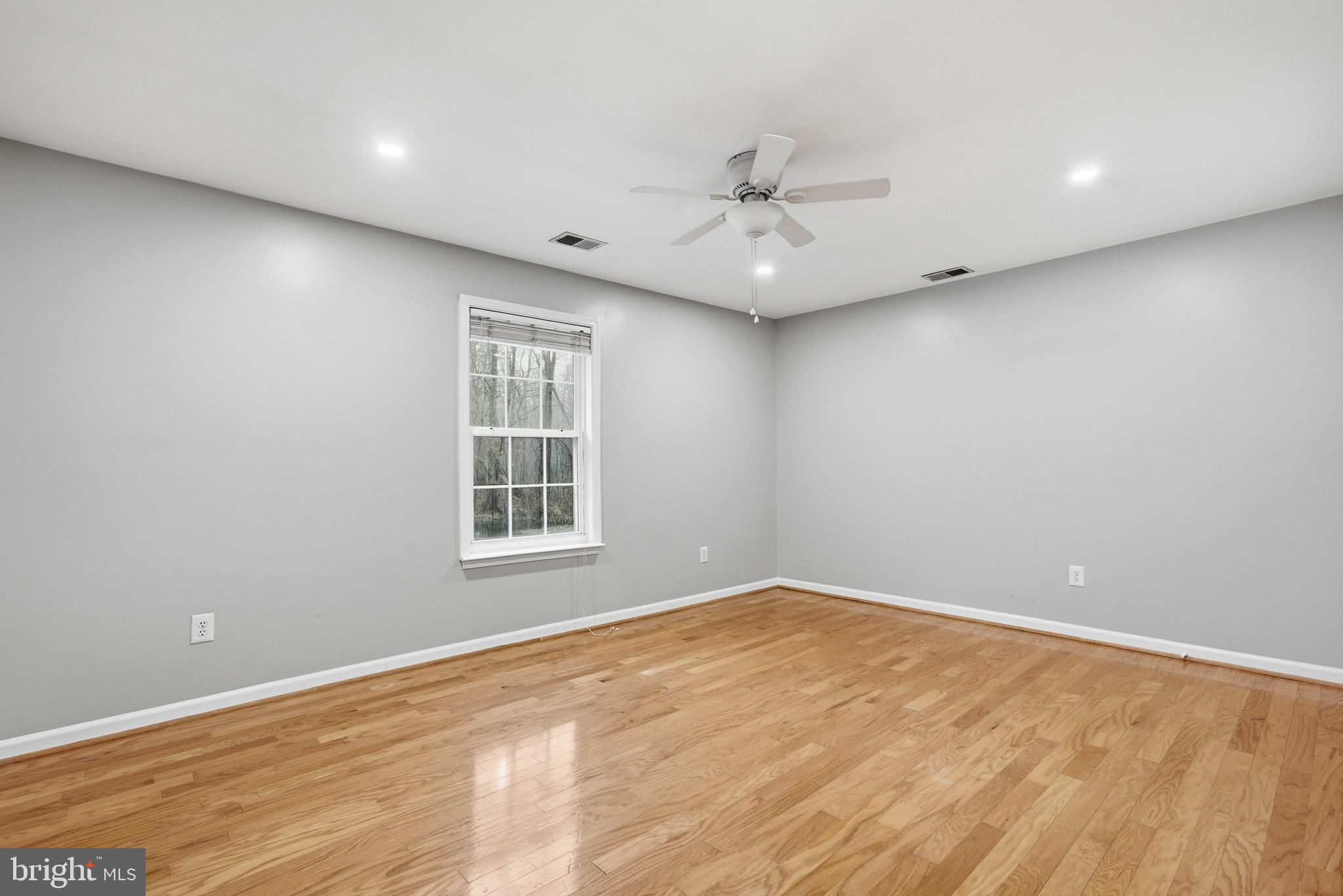 22343 Newtowne Neck Road Leonardtown, MD 20650 - Photo 33 of 40 Seondary bedroom with beautiful wood floors.