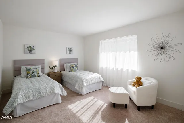 a view of a chairs and table in the roof deck