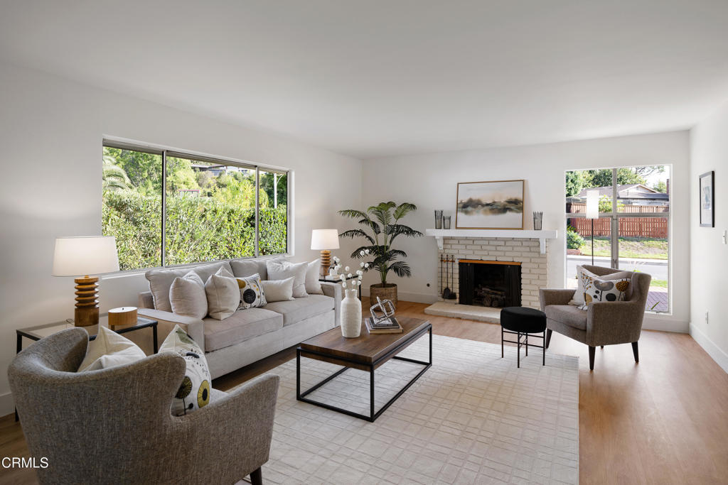 3514 St Elizabeth Road Glendale, CA 91206 - Photo 6 of 75 a living room with furniture a fireplace and a large window
