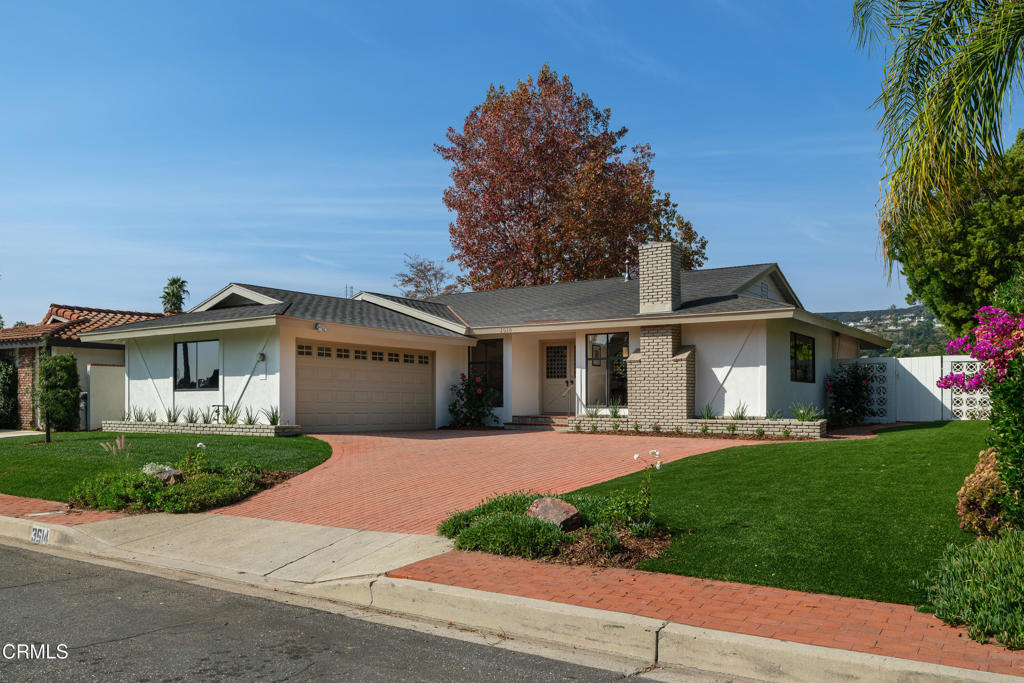 3514 St Elizabeth Road Glendale, CA 91206 - Photo 63 of 75 a front view of a house with a yard and garage