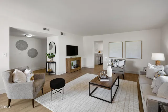 a view of a dining room with furniture and wooden floor