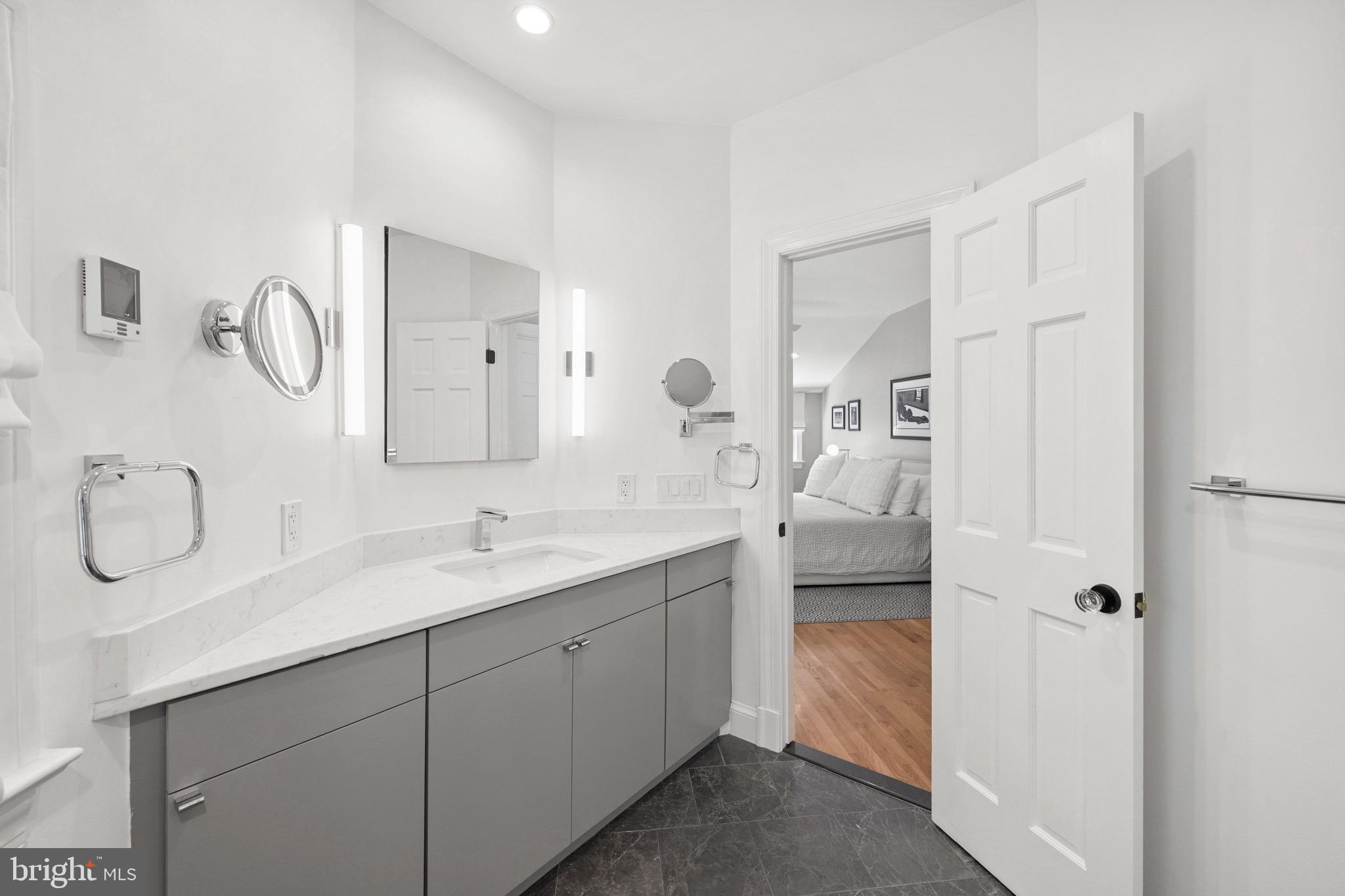 7409 Ridgewood Avenue Chevy Chase, MD 20815 - Photo 19 of 29 Marble bath