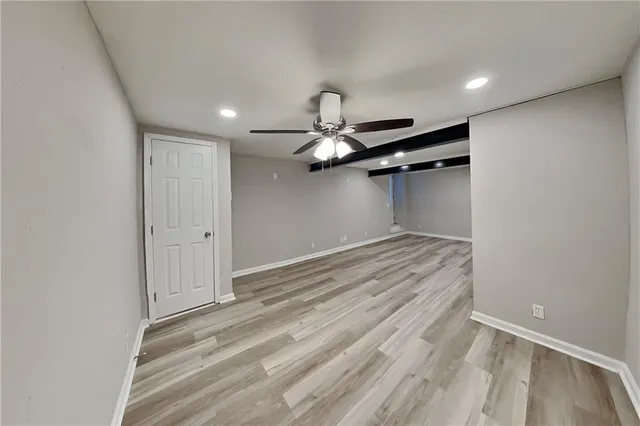 a view of room with a ceiling fan
