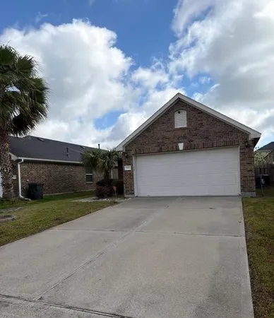 a front view of house with yard and trees