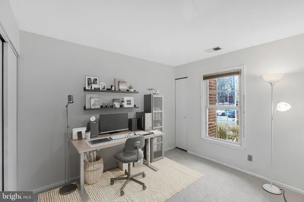 a workspace with furniture and window