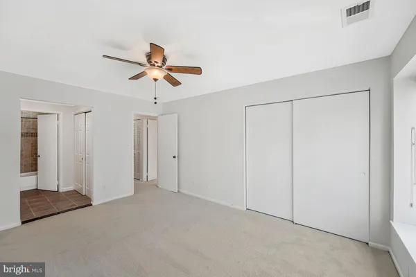 a view of a livingroom with a ceiling fan