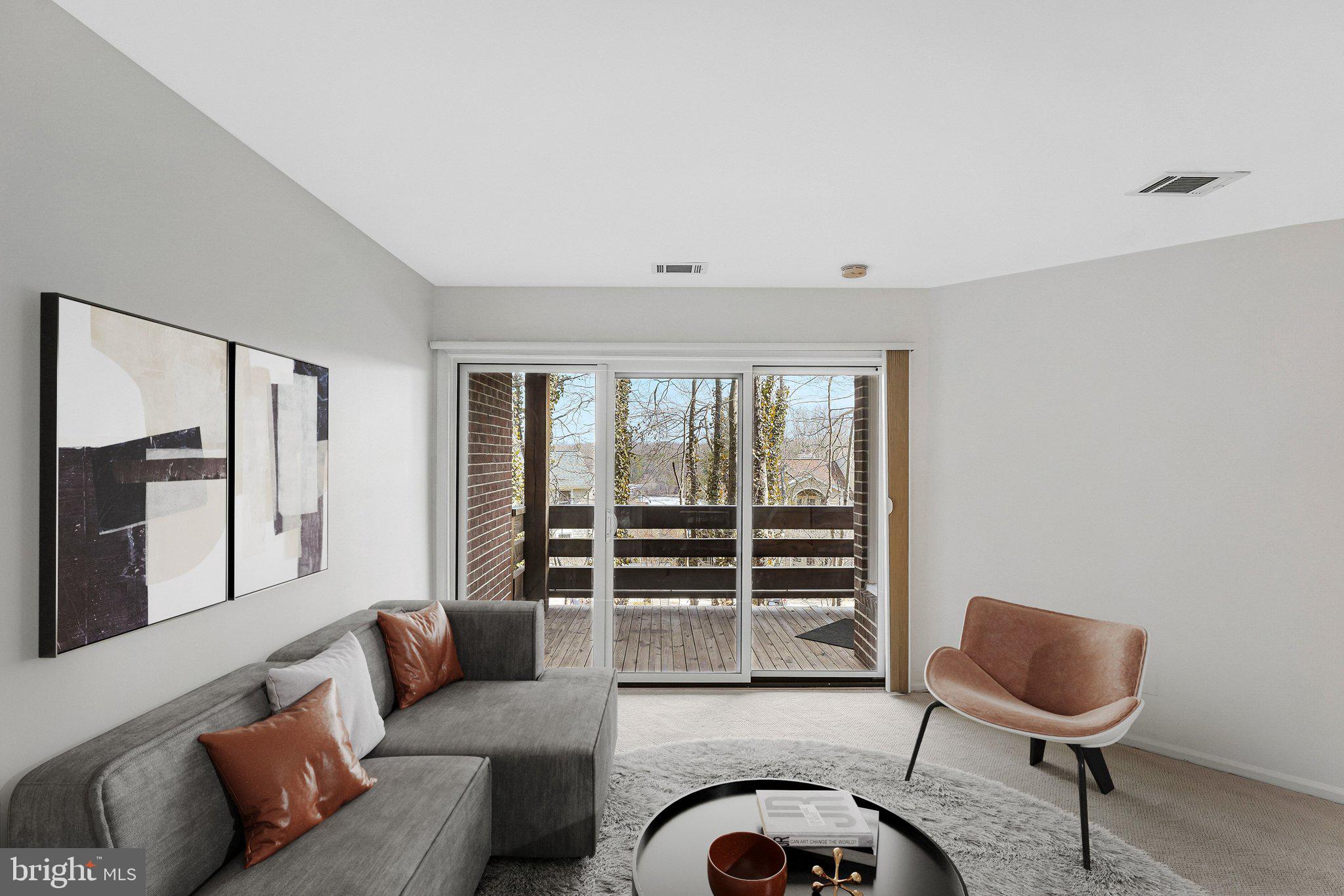 11144 Beaver Trail Court, Unit 11144 Reston, VA 20191 - Photo 3 of 24 Sliding glass doors from living to balcony