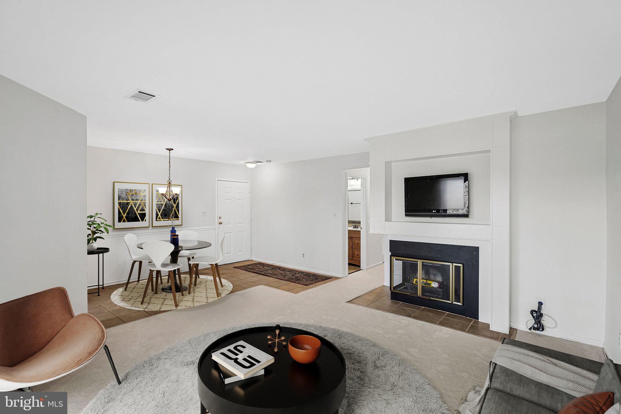 11144 Beaver Trail Court, Unit 11144 Reston, VA 20191 - Photo 4 of 24 Fireplaceand built-in shelves