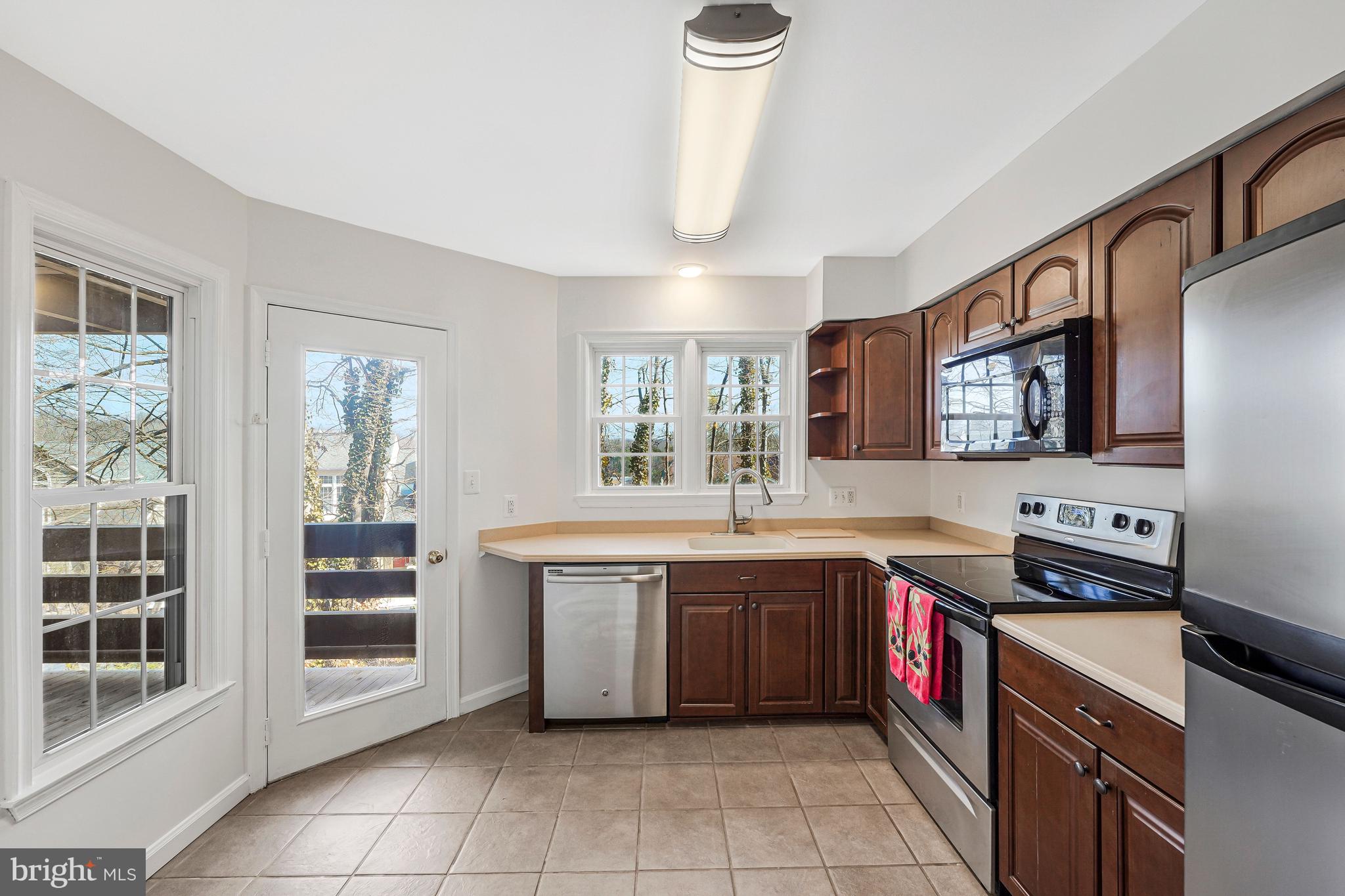 11144 Beaver Trail Court, Unit 11144 Reston, VA 20191 - Photo 6 of 24 Kitchen access to balcony