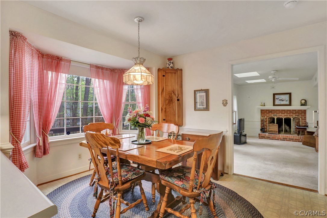 6201 Lansgate Road Midlothian, VA 23112 - Photo 14 of 31 a view of a dining room with furniture window and wooden floor