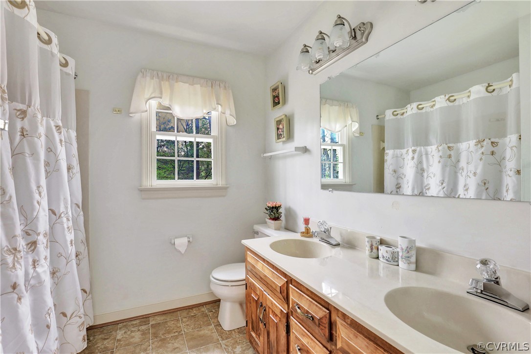 6201 Lansgate Road Midlothian, VA 23112 - Photo 23 of 31 a bathroom with a sink double vanity and a mirror