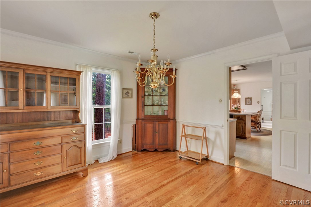 6201 Lansgate Road Midlothian, VA 23112 - Photo 7 of 31 a view of a livingroom with furniture cabinet wooden floor and windows