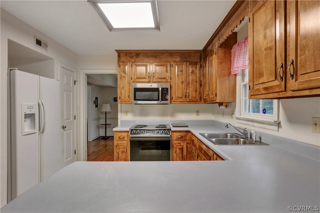 6201 Lansgate Road Midlothian, VA 23112 - Photo 10 of 31 a kitchen with stainless steel appliances granite countertop a stove a sink and a refrigerator