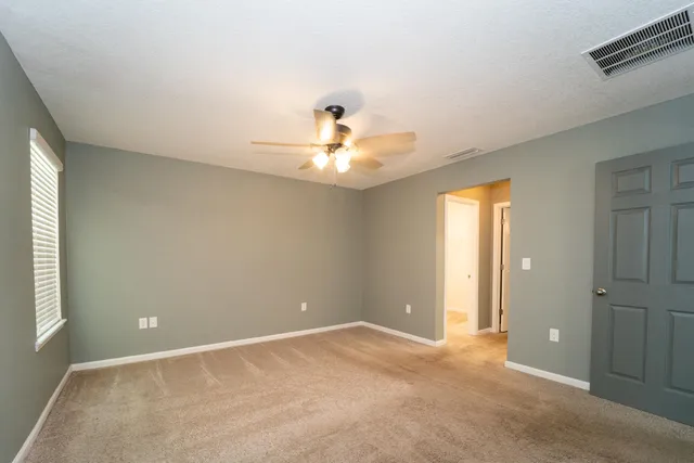 a view of a livingroom with a sink and a window