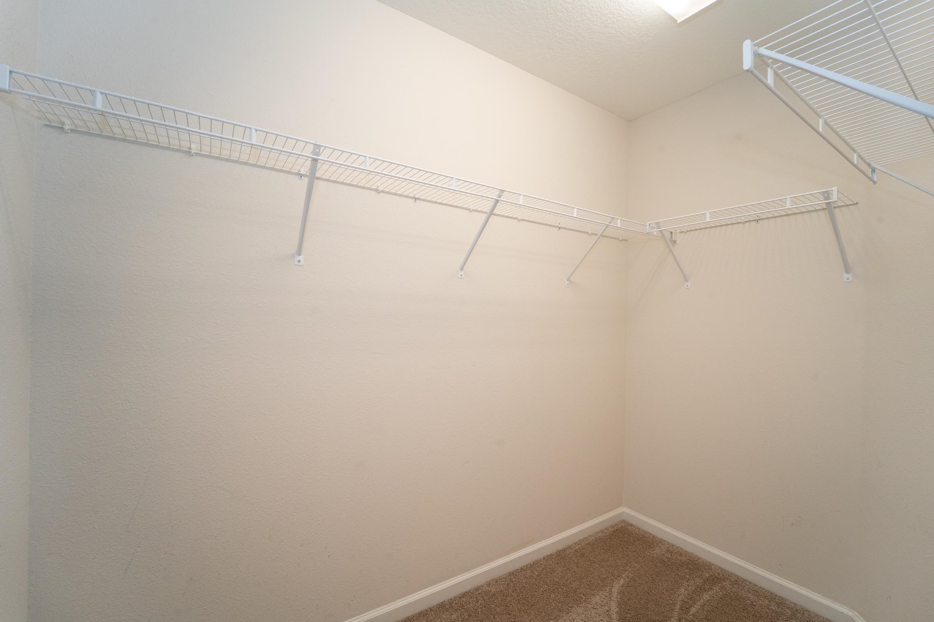 415 Santorini Court St. Augustine, FL 32086 - Photo 14 of 52 a view of a room with racks on the wall