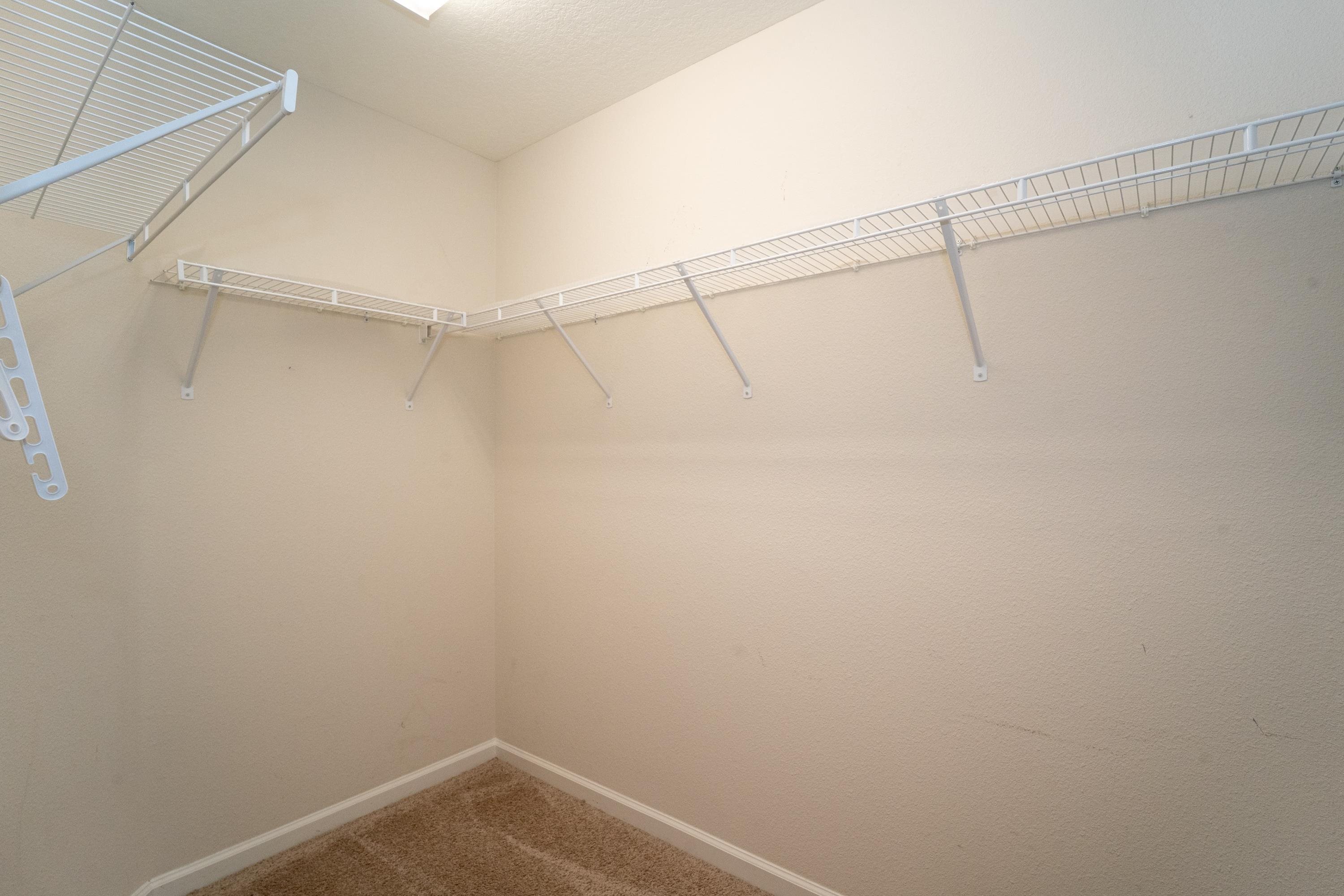 415 Santorini Court St. Augustine, FL 32086 - Photo 15 of 52 a view of a room with racks on the wall