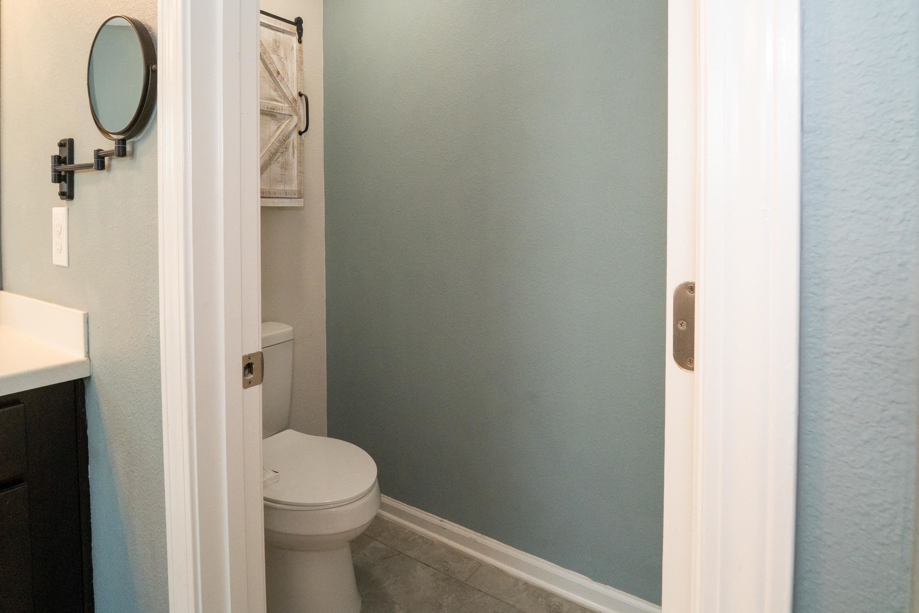415 Santorini Court St. Augustine, FL 32086 - Photo 17 of 52 a bathroom with a granite countertop toilet and a sink