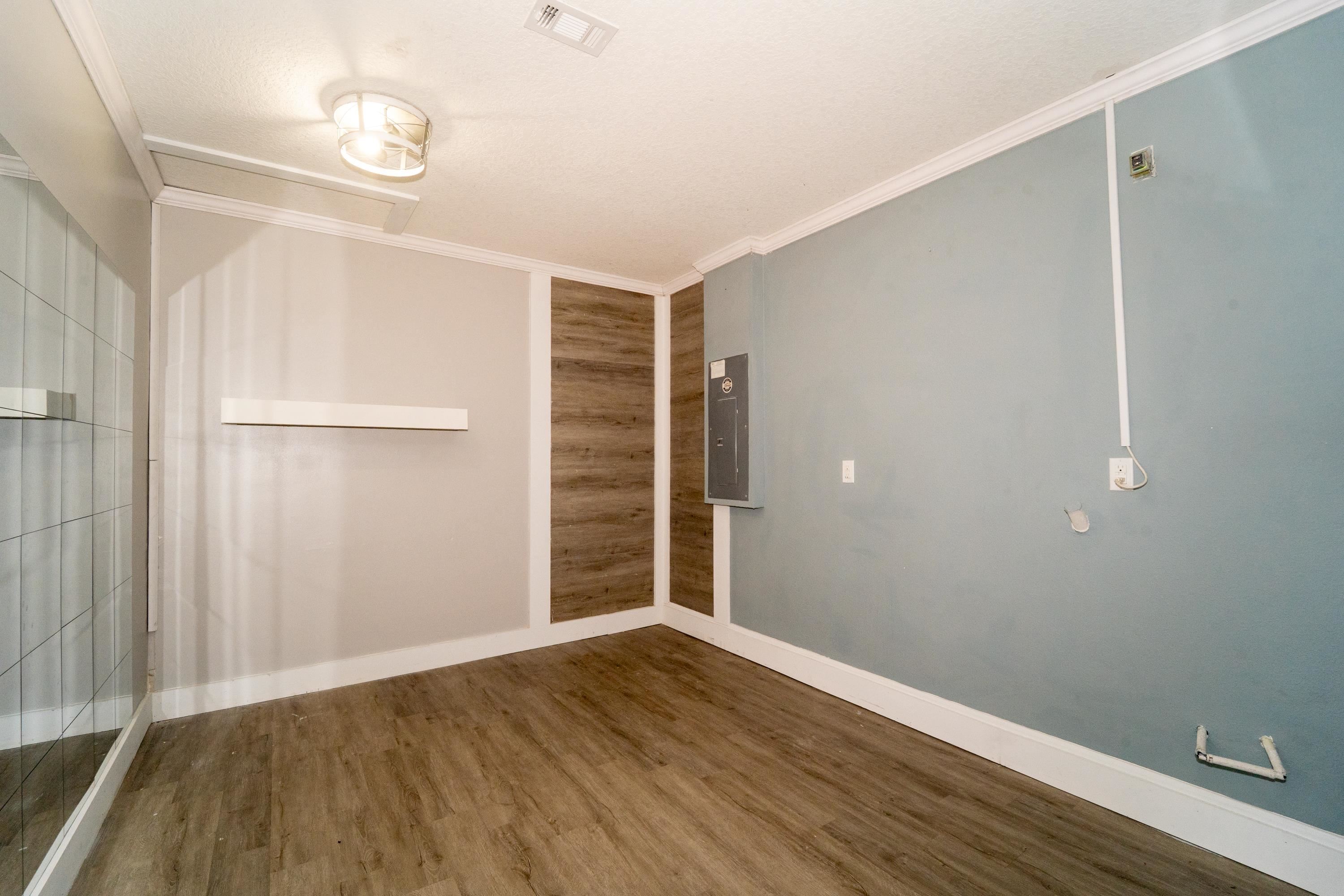 415 Santorini Court St. Augustine, FL 32086 - Photo 26 of 52 a view of an empty room with wooden floor