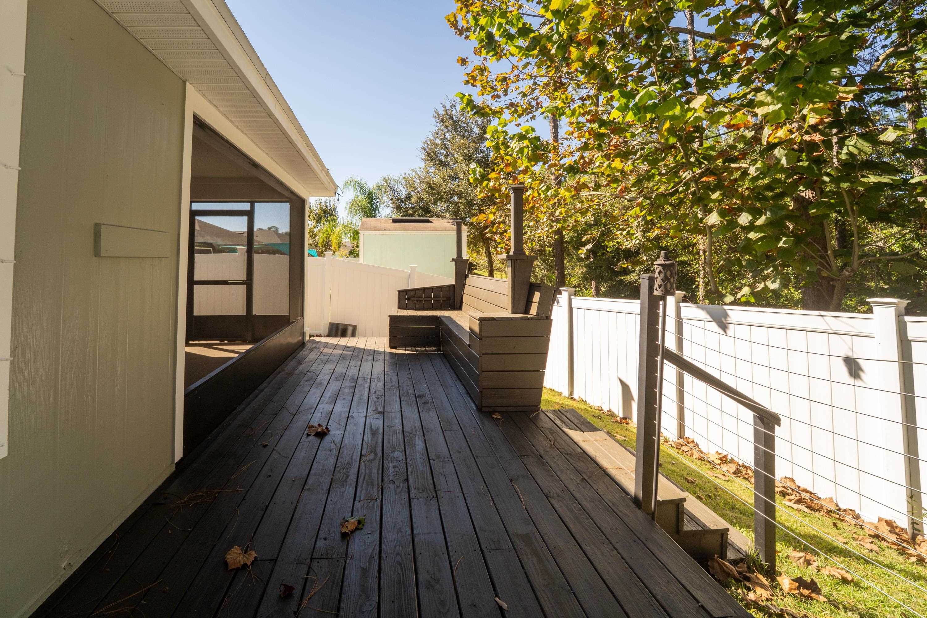 415 Santorini Court St. Augustine, FL 32086 - Photo 31 of 52 a view of balcony with wooden floor and fence