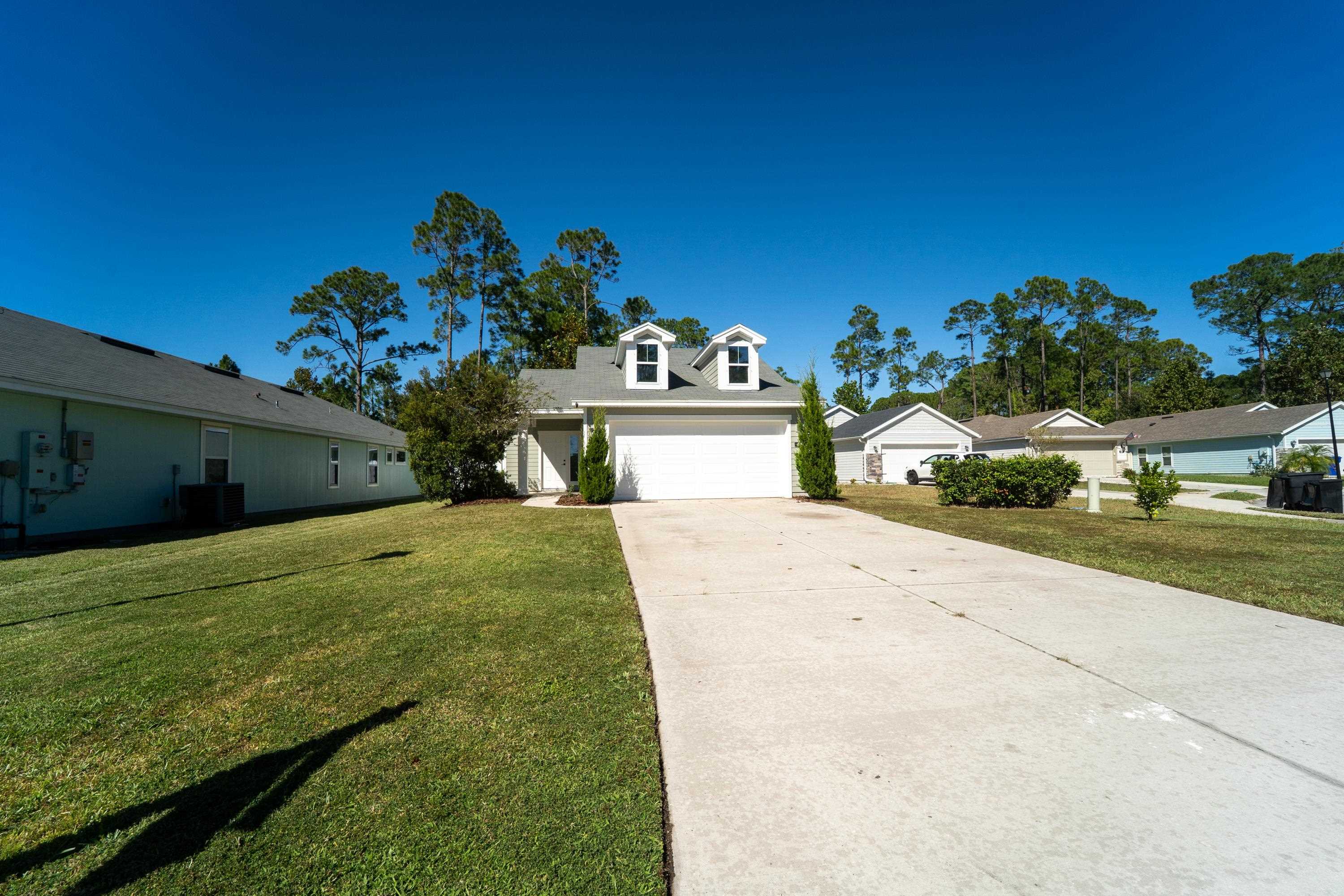 415 Santorini Court St. Augustine, FL 32086 - Photo 32 of 52 a bathroom with a sink mirror and vanity