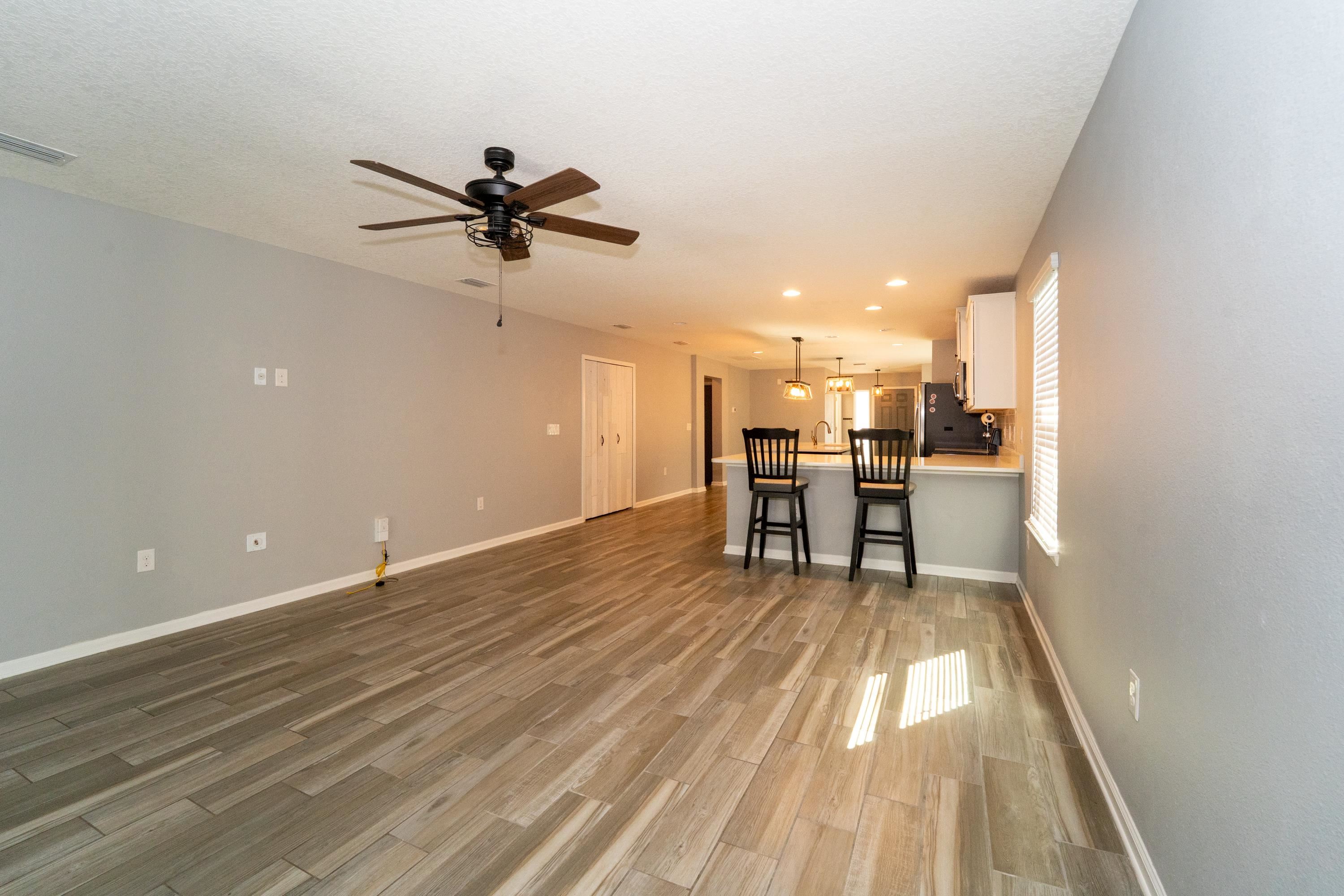 415 Santorini Court St. Augustine, FL 32086 - Photo 4 of 52 a view of a kitchen with a sink and cabinets