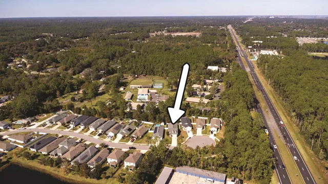 a view of a house with a backyard and shower
