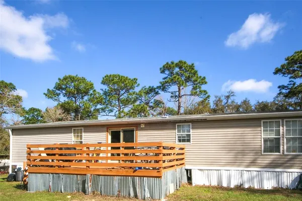a view of a swimming pool with an outdoor space and seating area