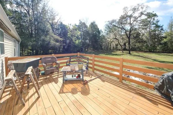 a view of a swimming pool with an outdoor space and seating area
