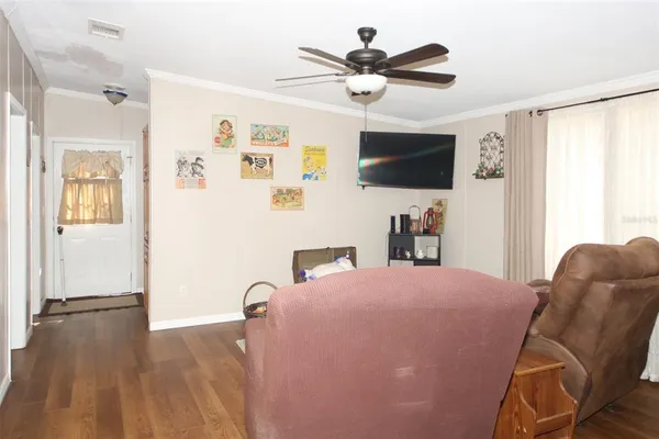 a kitchen with refrigerator and cabinets