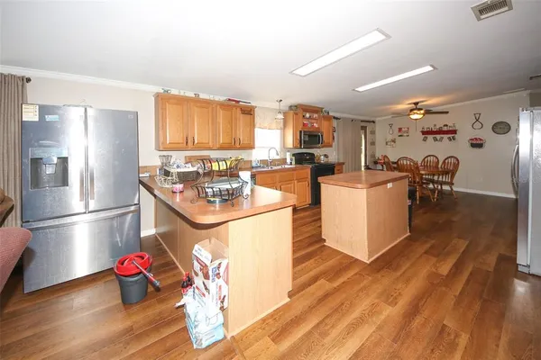 a bedroom with a bed and painting on the wall