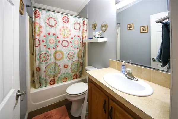 a hallway with a white stove top oven and next to a window