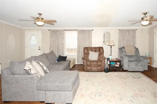 a living room with furniture and a window