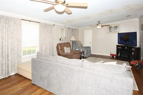a bathroom with a toilet and a shower curtain