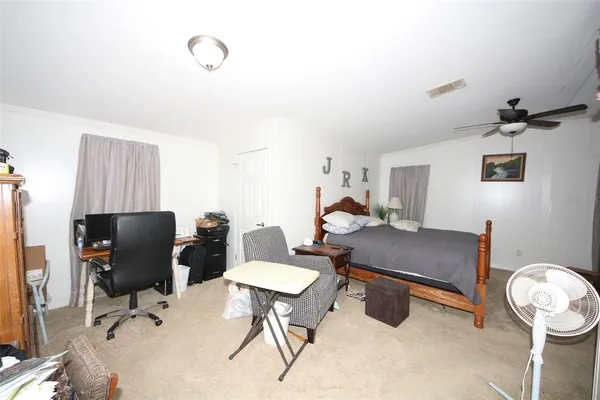 a view of gym equipment with kitchen view