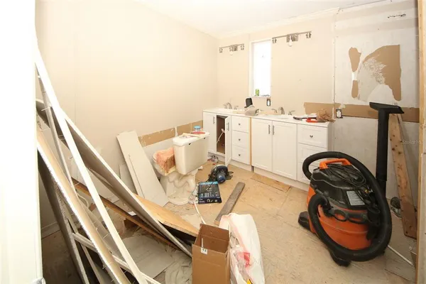 a bedroom with furniture and window