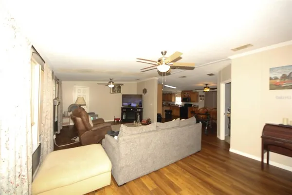 a kitchen with granite countertop a sink a stove and refrigerator