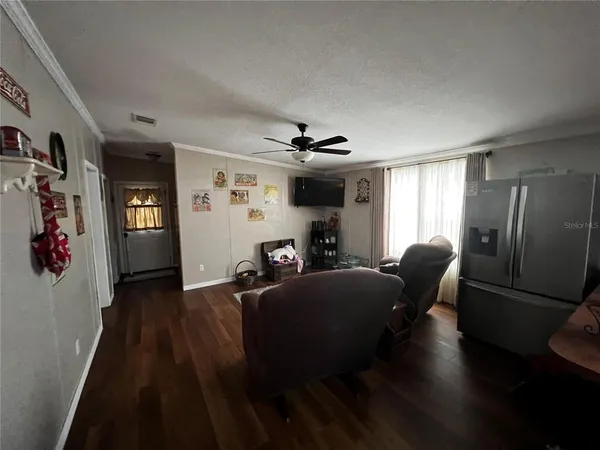 a living room with furniture and a window