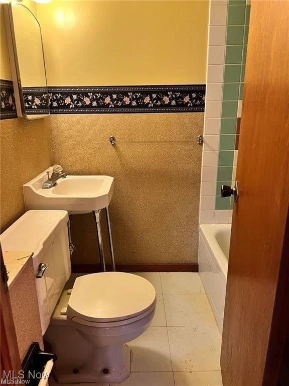 8581 Fair Road Strongsville, OH 44149 - Photo 20 of 20 Bathroom with light tile patterned floors and bathtub / shower combination