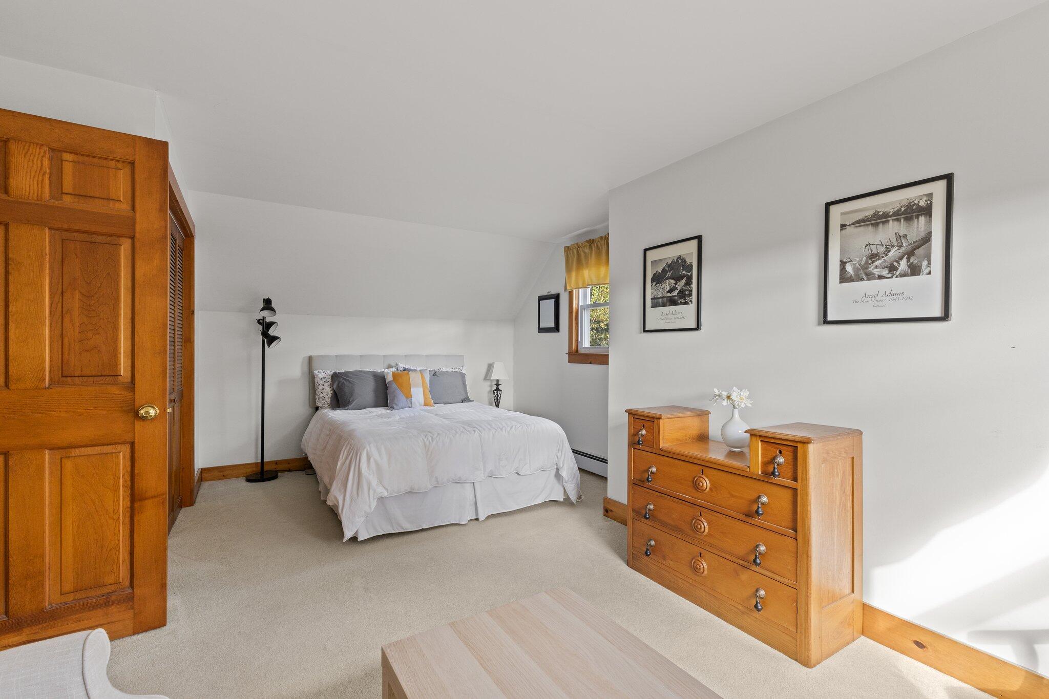 176 Maple Street West Barnstable, MA 02668 - Photo 39 of 83 a bedroom with a bed and wooden floor