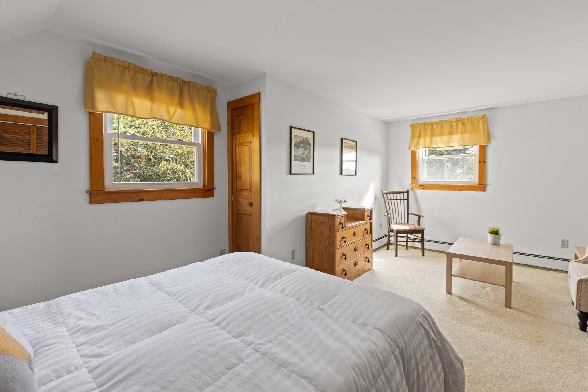 176 Maple Street West Barnstable, MA 02668 - Photo 41 of 83 a bedroom with a bed and a table in it