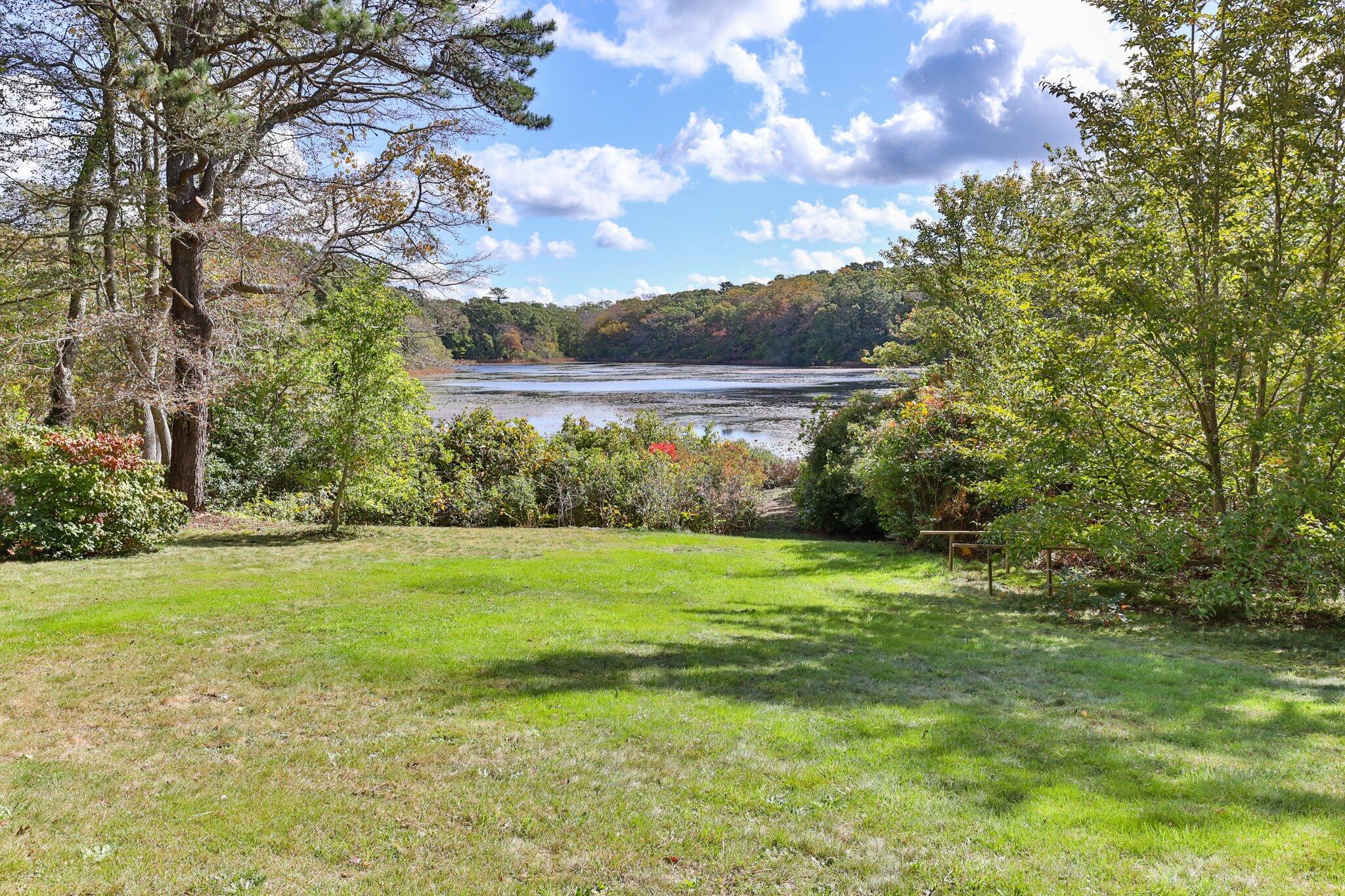 176 Maple Street West Barnstable, MA 02668 - Photo 65 of 83 a view of a grassy field with an trees