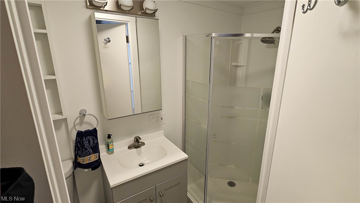 19755 Upper Terrace Road Euclid, OH 44117 - Photo 24 of 38 Bathroom with shower and built in shelving.