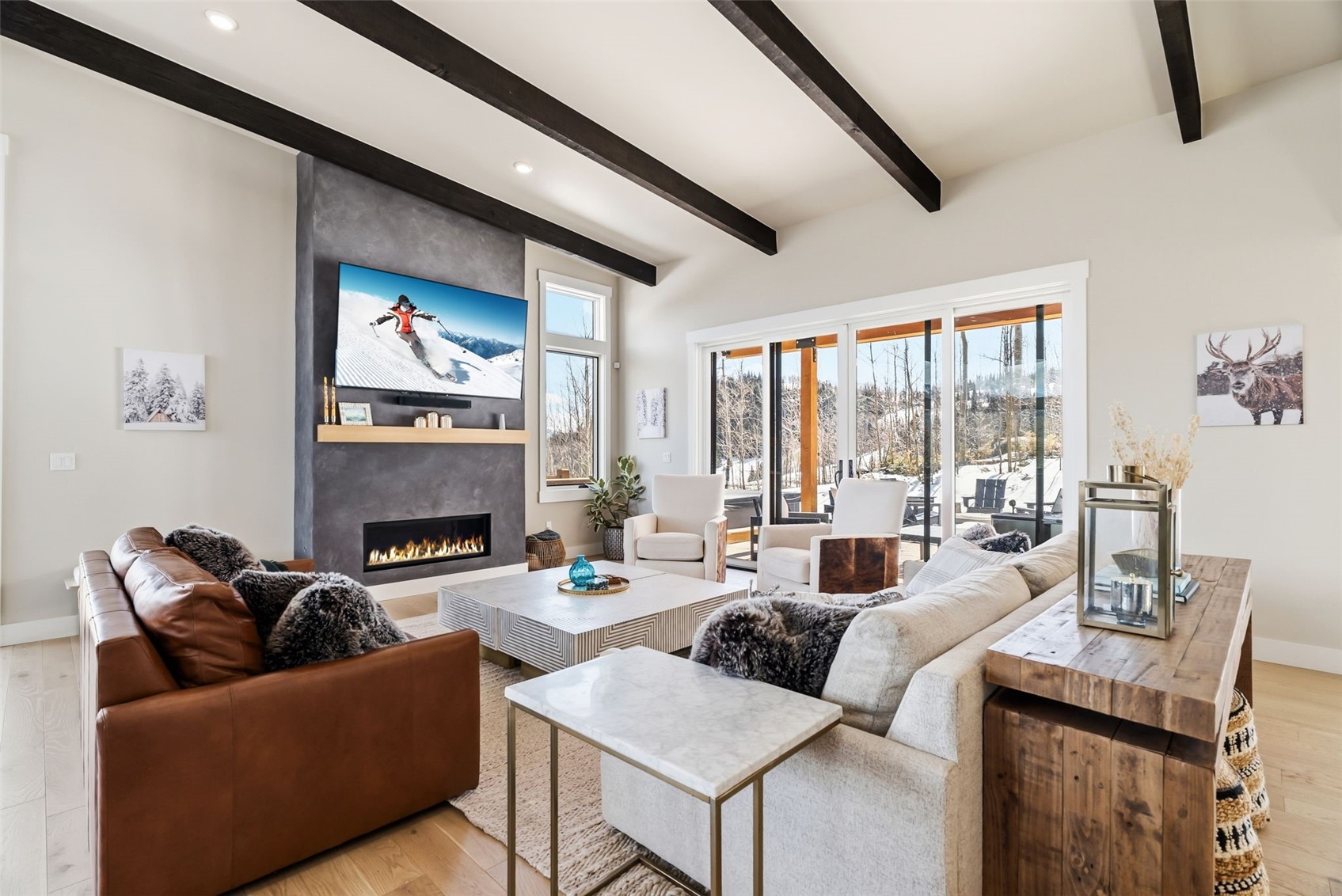 Bright living room with large windows and gas fireplace