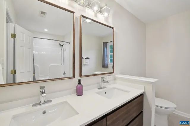 a bathroom with a sink vanity and a mirror