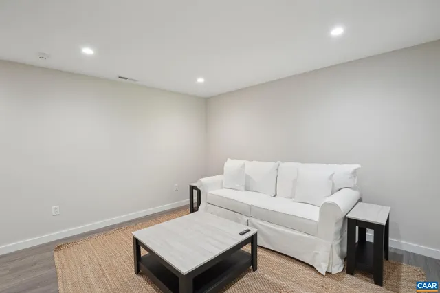 a bedroom with a bed and a night stand